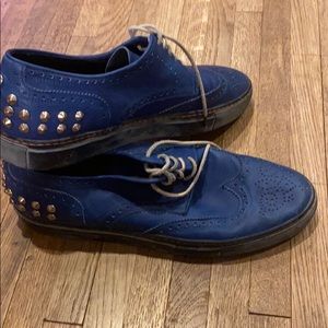 Blue Creative Recreation shoes with silver spikes